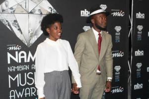 At the Namibian Music Awards being prompted for a picture with Loux the Vintage Guru